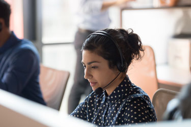 helpdesk woman looking at computer