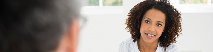 Woman having conversation with behavioral health care coordinators